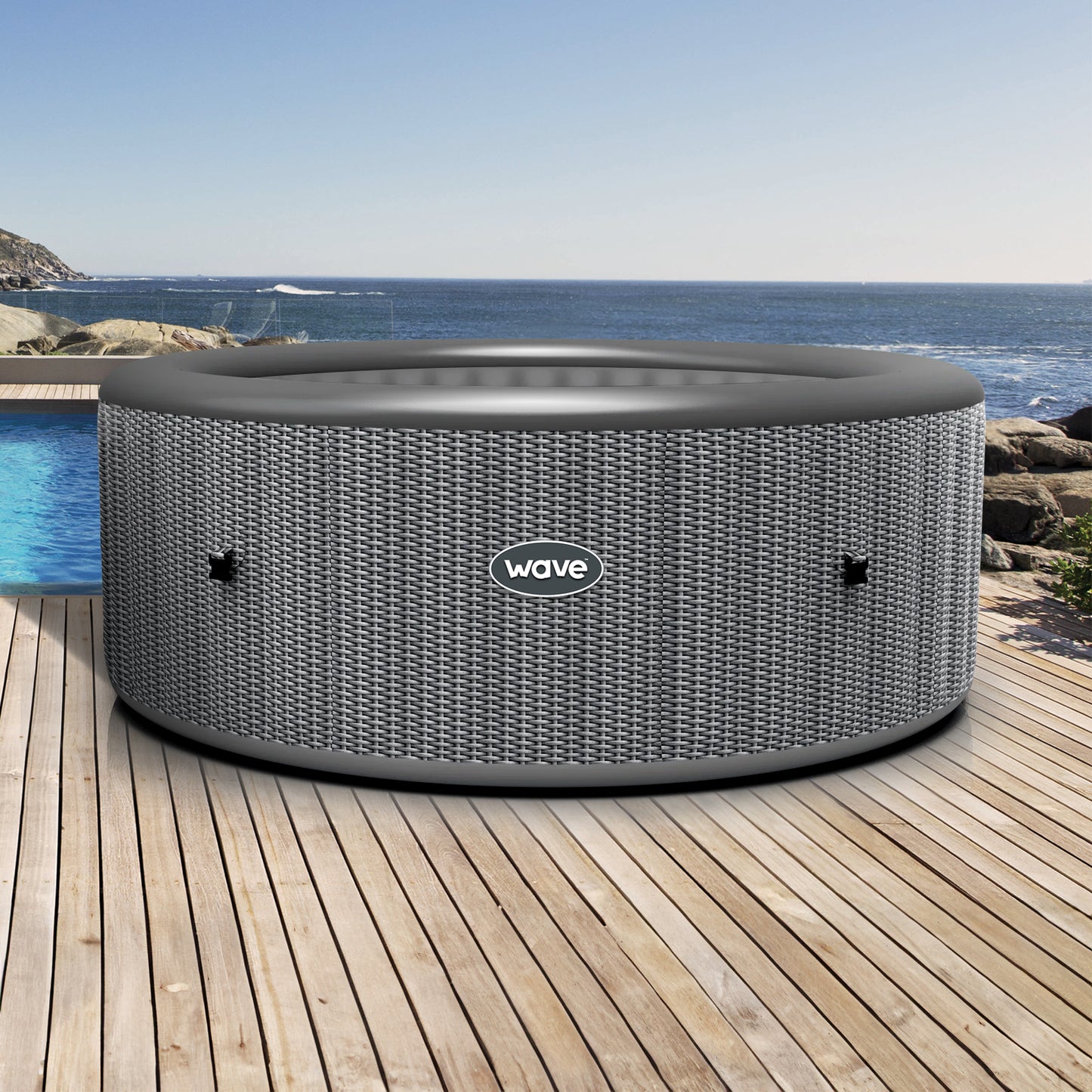 Inflatable 'Atlantic' hot tub by Wave Spas in Rattan Grey presented in sunny outdoor pool setting.