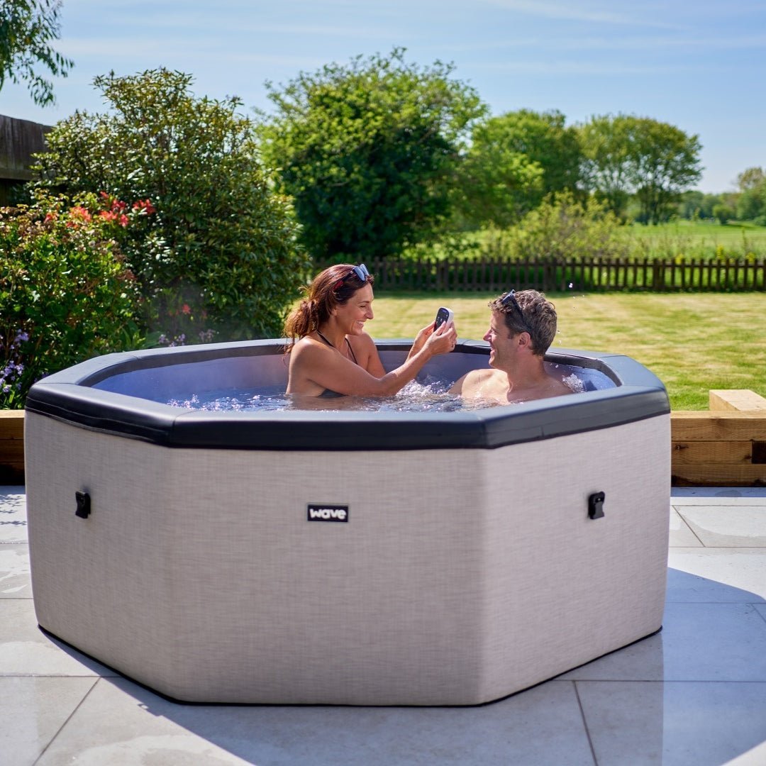 Couple enjoying the Como 6 person eco foam spa by Wave Spas.