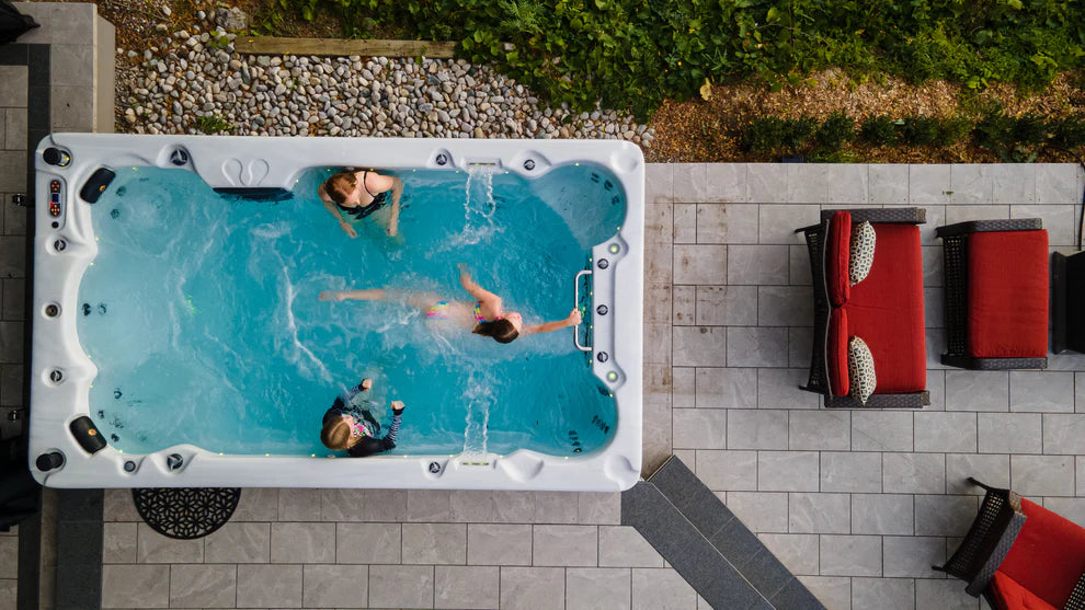 Canadian Spa Company St. Lawrence 13ft Swim Spa lifestyle image of family using spa.