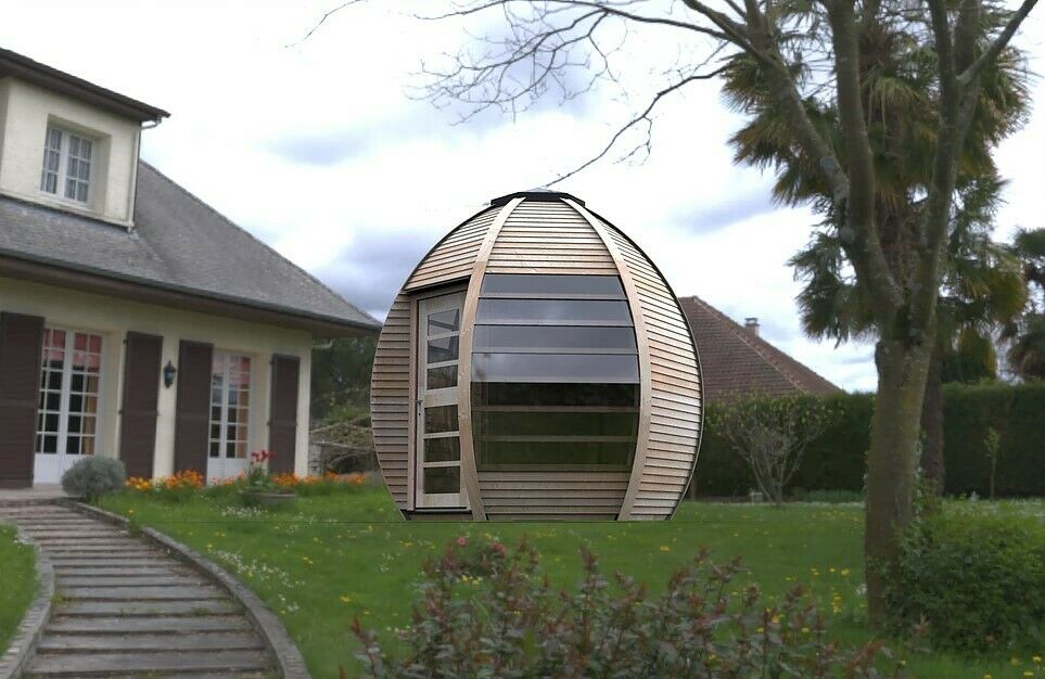 Crown Smart Huuden Garden Room set in back garden of house. 