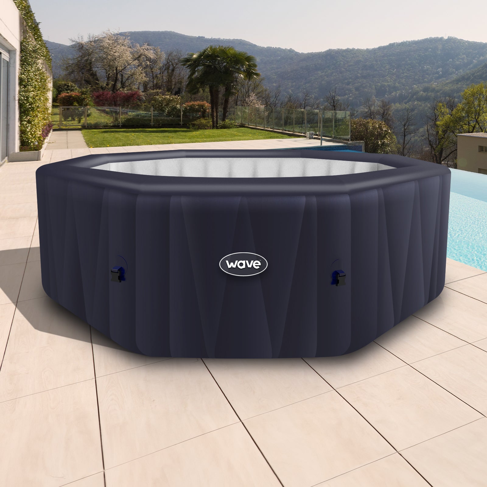 Aegean Navy Blue Inflatable Spa next to pool in garden.