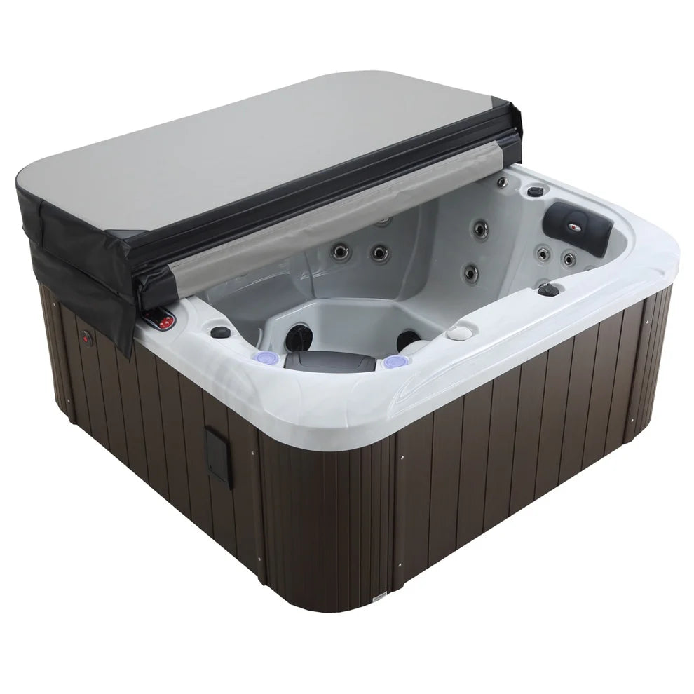 Cambridge Spa by Canadian Spa Company showing partially covered empty hot tub with cover half reclined over the top. 