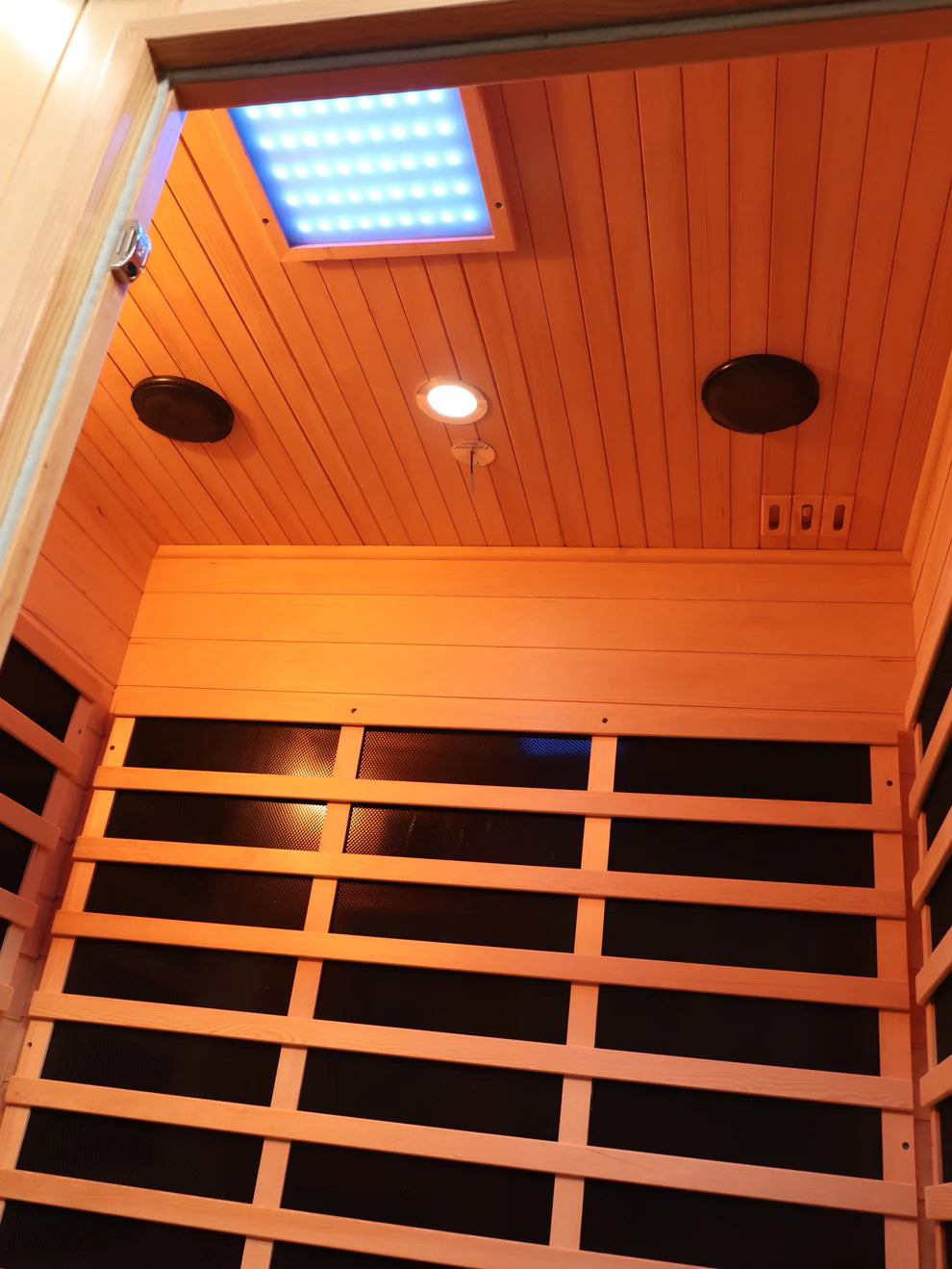 Canadian Spa Company Tremblant 2 Person Indoor Infrared Sauna showing interior panels and speakers. 