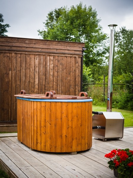 Viking Industrier Ofuro Hot Tub with lid on in garden setting. 