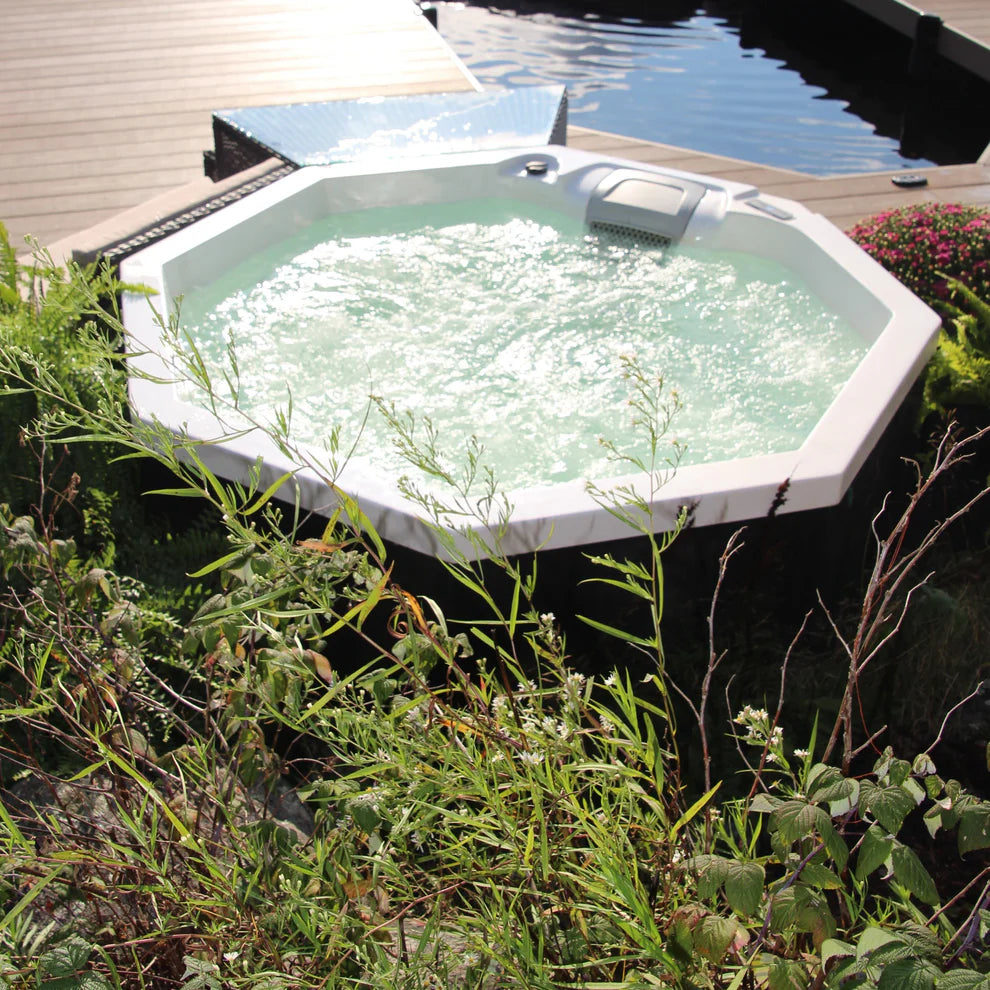 Muskoka 14-Jet 4-Person Spa set in garden setting showing jet bubble system in action. 