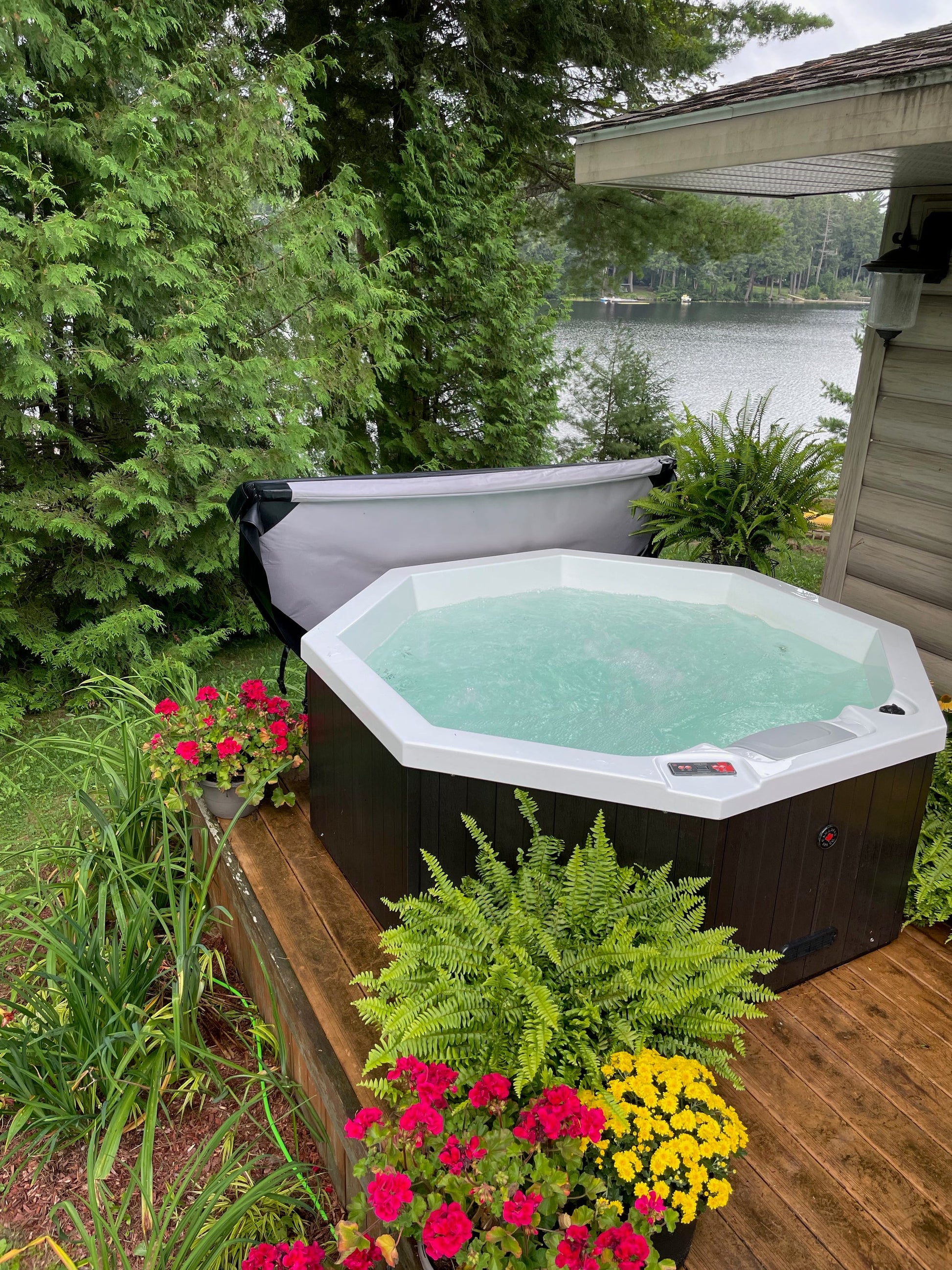 Muskoka 14-Jet 4-Person Spa by Canadian Spa Company in green garden setting. 