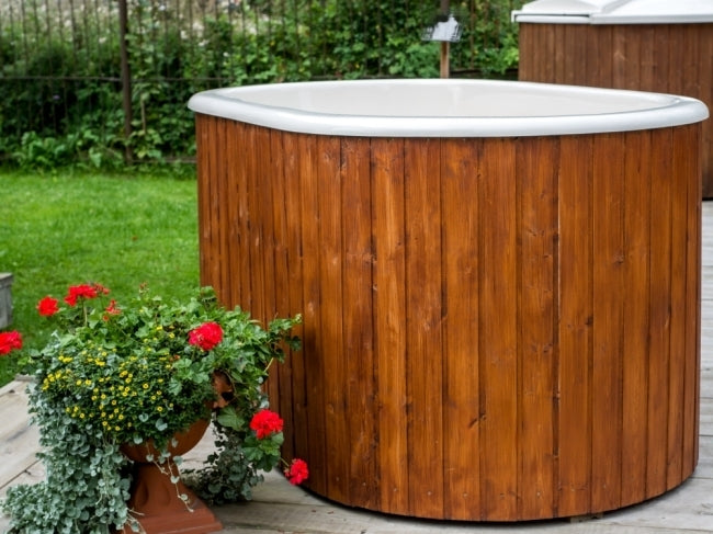 Viking Industrier Ofuro Hot Tub in green garden setting unfilled. 